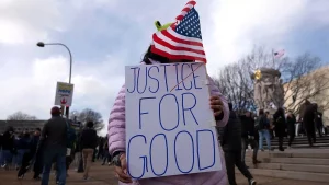 Weaponized Disrespect: Federal Officer Tramples Candle for Renee Good Amidst Self-Defense Claims